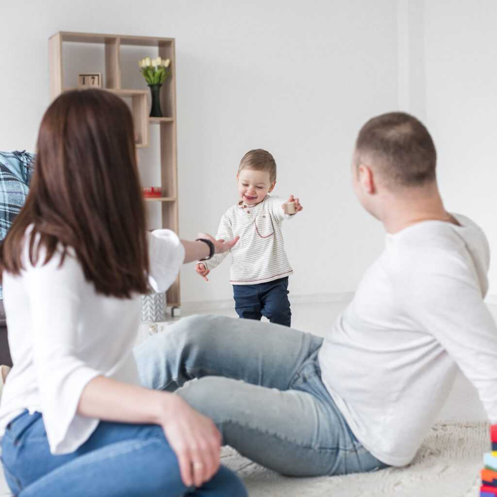 parents-with-smiley-baby-home