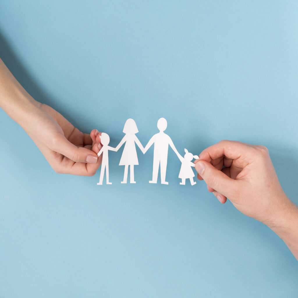 top-view-people-holding-hands-cute-paper-family